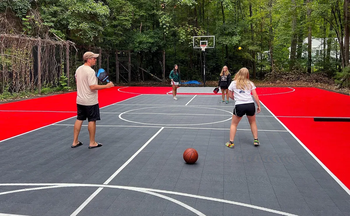 Backyard pickleball court built from interlocking tiles