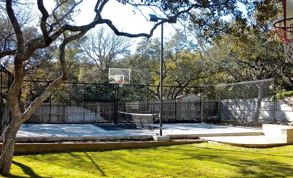 Multi-sport backyard court with overlay line markings